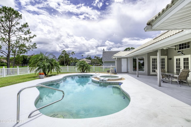 7 Foxfords Chase, Ormond Beach, FL 32174 - view of swimming pool with french doors, a patio area, a fenced backyard, and a pool with connected hot tub