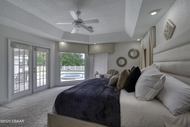 7 Foxfords Chase, Ormond Beach, FL 32174 - carpeted bedroom with access to outside, a textured ceiling, a raised ceiling, and a ceiling fan