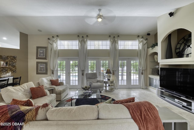 7 Foxfords Chase, Ormond Beach, FL 32174 - living room featuring a ceiling fan, french doors, and a towering ceiling