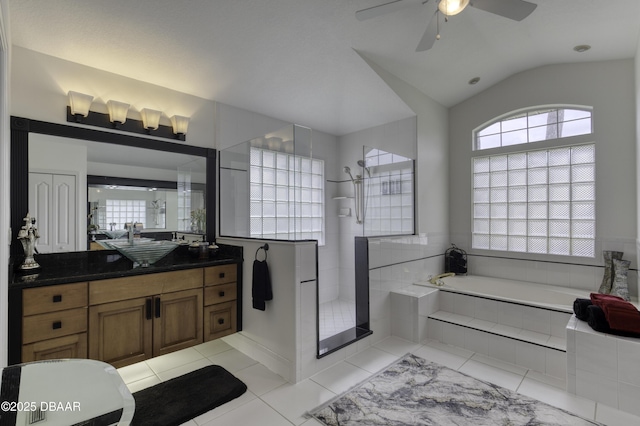 7 Foxfords Chase, Ormond Beach, FL 32174 - bathroom with a bath, a tile shower, vanity, tile patterned floors, and a ceiling fan