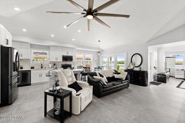 5967 Riverside Dr, Port Orange, FL 32127 - living area featuring vaulted ceiling, healthy amount of natural light, ceiling fan, and recessed lighting