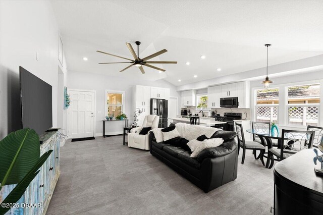 5967 Riverside Dr, Port Orange, FL 32127 - living area with a ceiling fan, vaulted ceiling, and recessed lighting