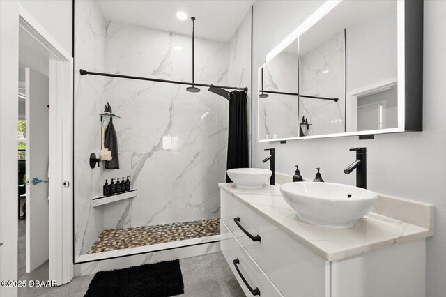 5967 Riverside Dr, Port Orange, FL 32127 - full bathroom with double vanity and a marble finish shower