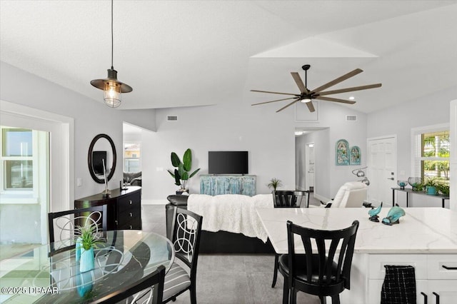 5967 Riverside Dr, Port Orange, FL 32127 - dining room featuring a ceiling fan and vaulted ceiling