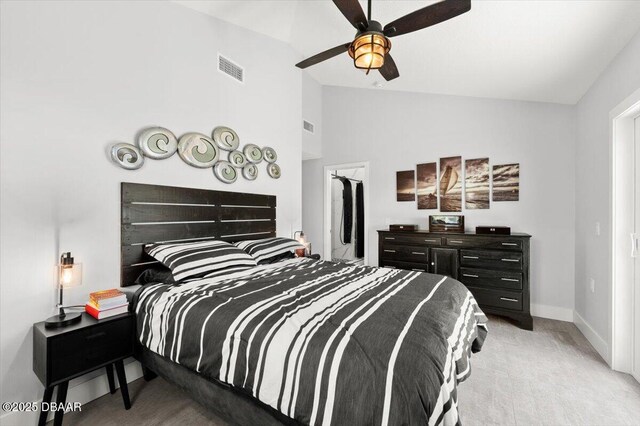 5967 Riverside Dr, Port Orange, FL 32127 - carpeted bedroom featuring lofted ceiling and ceiling fan