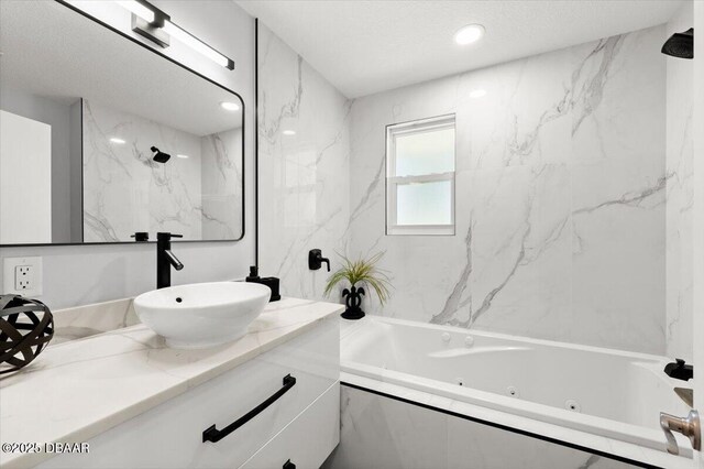 5967 Riverside Dr, Port Orange, FL 32127 - bathroom featuring a tub with jets and vanity