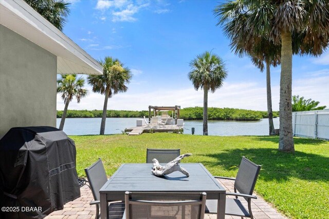 5967 Riverside Dr, Port Orange, FL 32127 - view of patio / terrace with a water view, outdoor dining space, and a grill