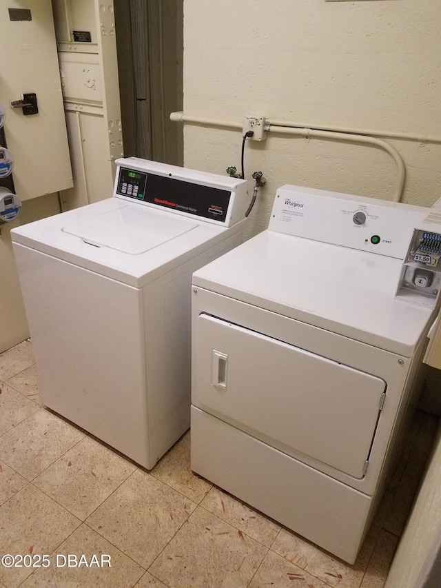 common laundry area featuring washing machine and clothes dryer