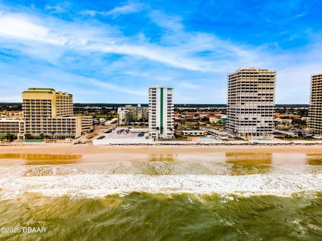 exterior space featuring a view of city and a beach view