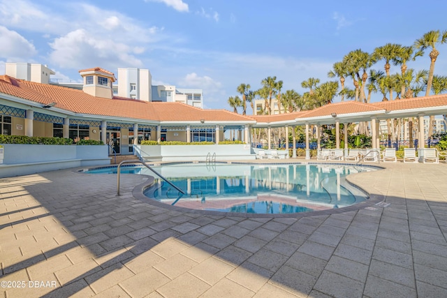 community pool with a patio area