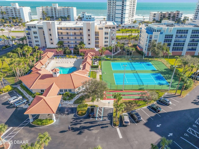 birds eye view of property featuring a water view and a city view