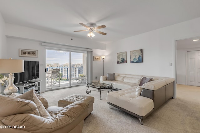 living room with light carpet and a ceiling fan