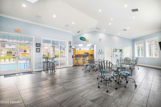 dining room with recessed lighting, visible vents, ornamental molding, vaulted ceiling, and baseboards