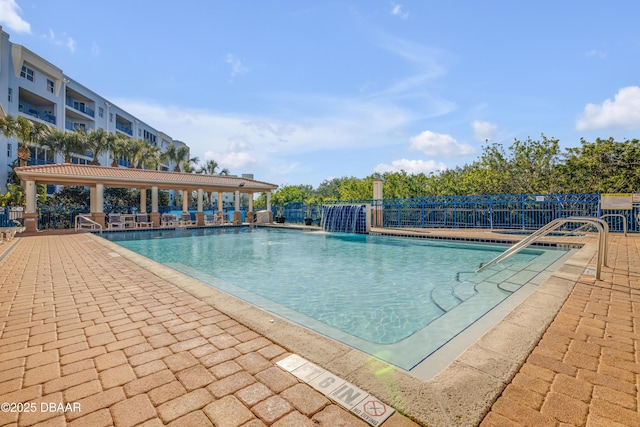 pool featuring a patio and fence