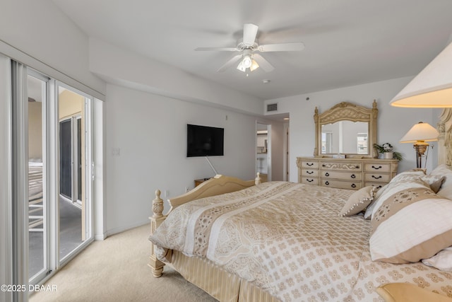 bedroom with light carpet, access to exterior, ceiling fan, and visible vents