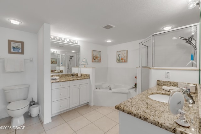 full bath featuring a sink, a shower stall, visible vents, and tile patterned flooring