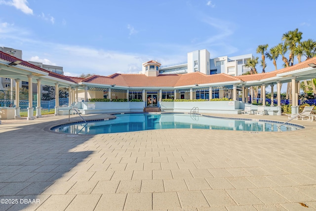 community pool featuring a patio area