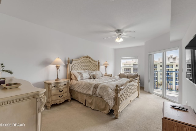 bedroom with light carpet, access to exterior, and a ceiling fan