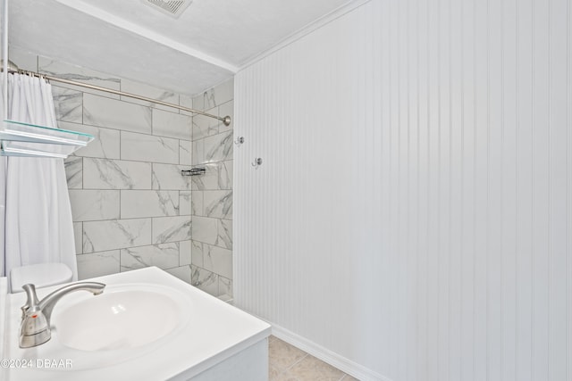 bathroom featuring a shower with curtain, tile patterned floors, and vanity