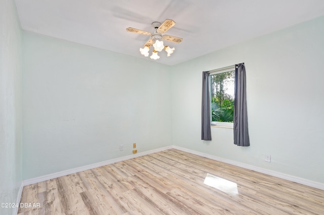 605 Orchard Ave, Ormond Beach, FL 32174 - empty room with wood finished floors, baseboards, and a ceiling fan