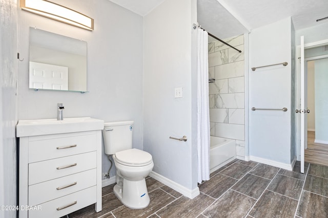 605 Orchard Ave, Ormond Beach, FL 32174 - bathroom with vanity, toilet, baseboards, washtub / shower combination, and wood finish floors