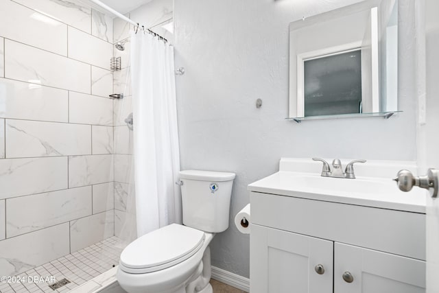 bathroom featuring toilet, vanity, and a shower with shower curtain