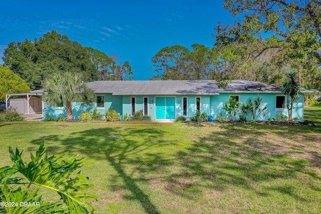 ranch-style home with a front lawn