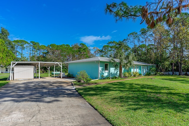 view of front facade featuring a front yard and a carport