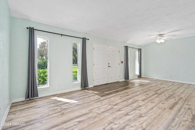 unfurnished room with light hardwood / wood-style floors, ceiling fan, and a healthy amount of sunlight