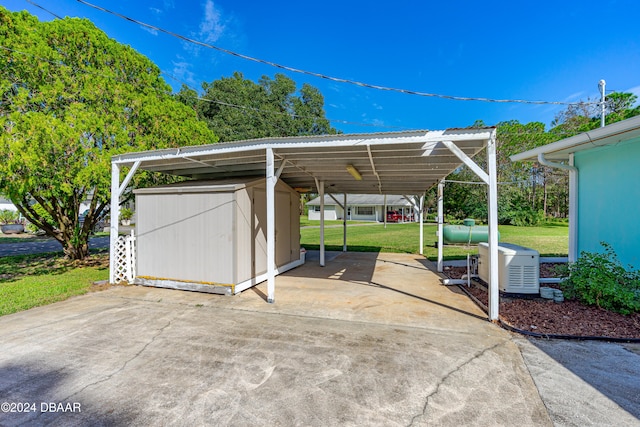 view of vehicle parking featuring a carport and a yard