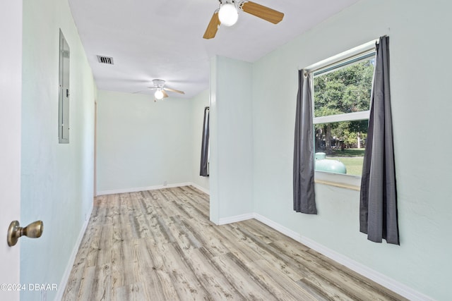 unfurnished room featuring ceiling fan and light hardwood / wood-style floors