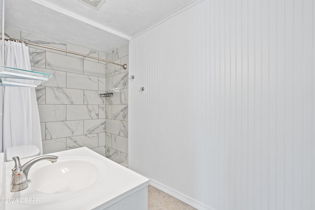 605 Orchard Ave, Ormond Beach, FL 32174 - full bath with tiled shower, tile patterned floors, crown molding, and vanity