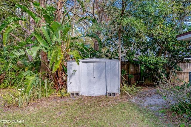 view of outbuilding with a yard