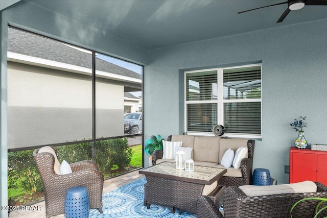 sunroom / solarium with ceiling fan