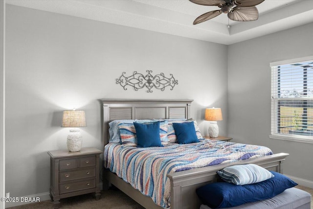 bedroom featuring dark colored carpet and ceiling fan