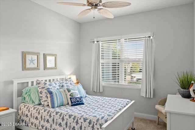 bedroom featuring ceiling fan and carpet flooring