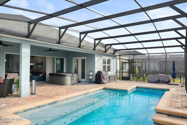 view of pool featuring glass enclosure, a patio, a grill, and ceiling fan