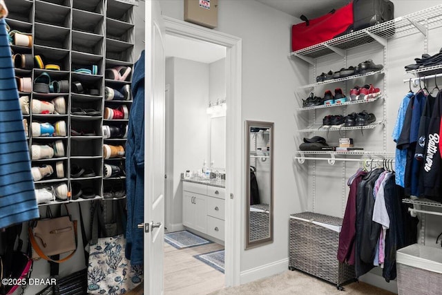 walk in closet featuring sink