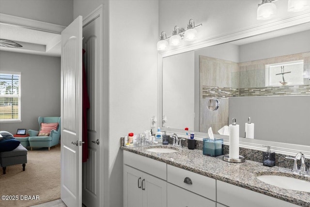 bathroom with walk in shower and vanity