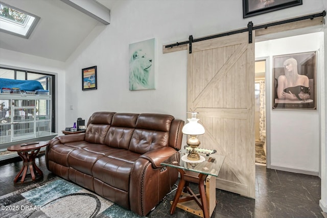 living room featuring a barn door and vaulted ceiling with skylight