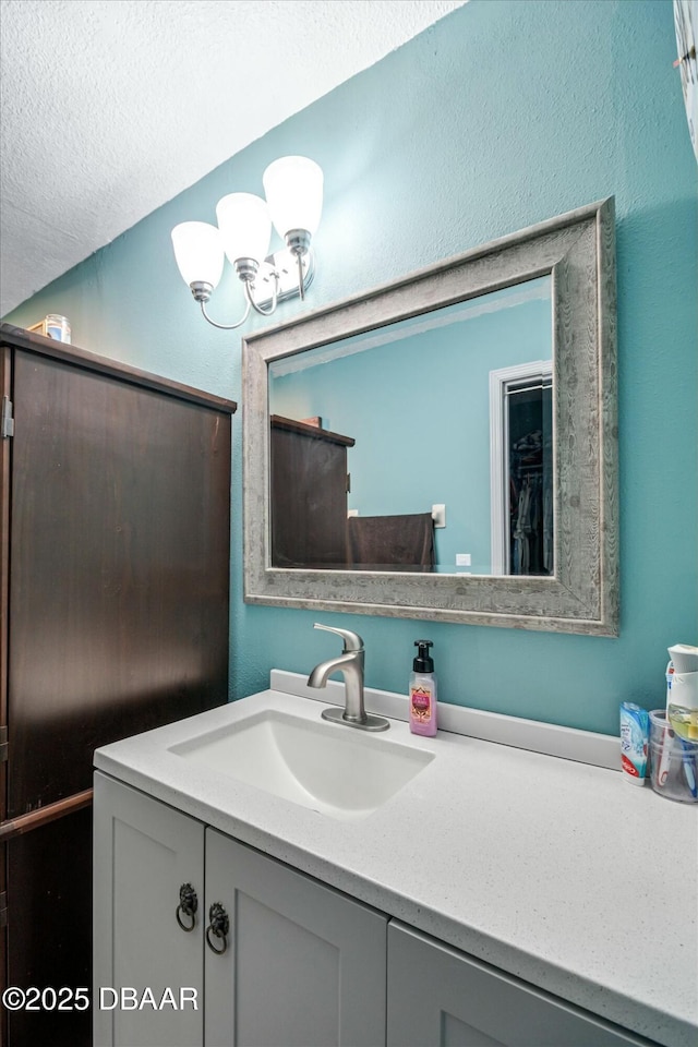 bathroom featuring vanity and a textured ceiling