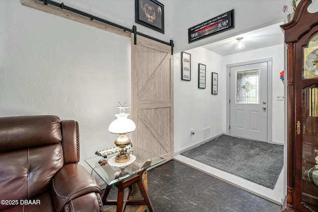 foyer featuring a barn door