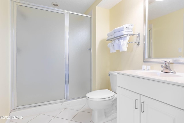 bathroom with tile patterned flooring, a textured ceiling, vanity, an enclosed shower, and toilet