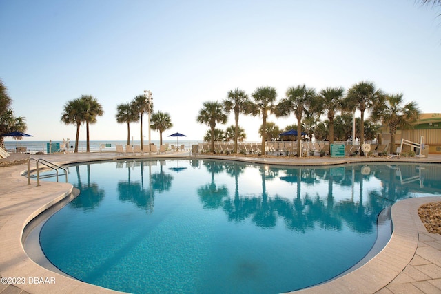 view of pool with a water view