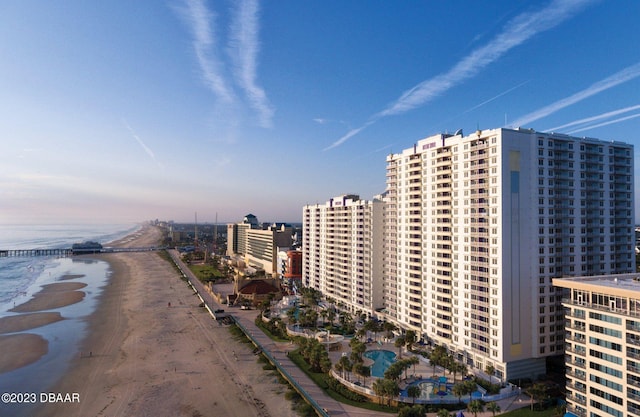 exterior space featuring a water view and a view of the beach