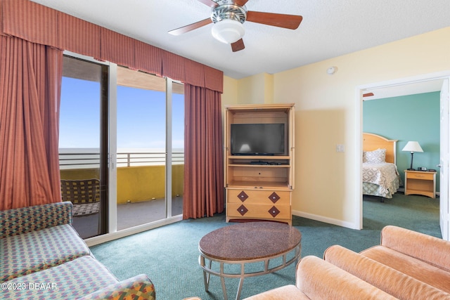 living room featuring carpet flooring and ceiling fan