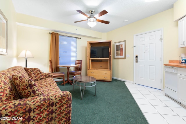 carpeted living room with ceiling fan