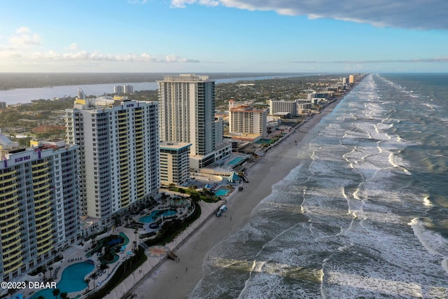 bird's eye view with a beach view and a water view