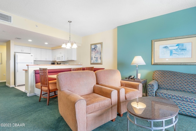 living room featuring a notable chandelier and carpet