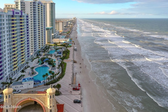 bird's eye view featuring a water view and a view of the beach